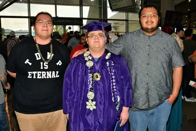 graduated boy with his family